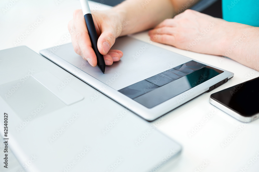Graphic designer working on digital tablet Graphic designer working on digital tablet