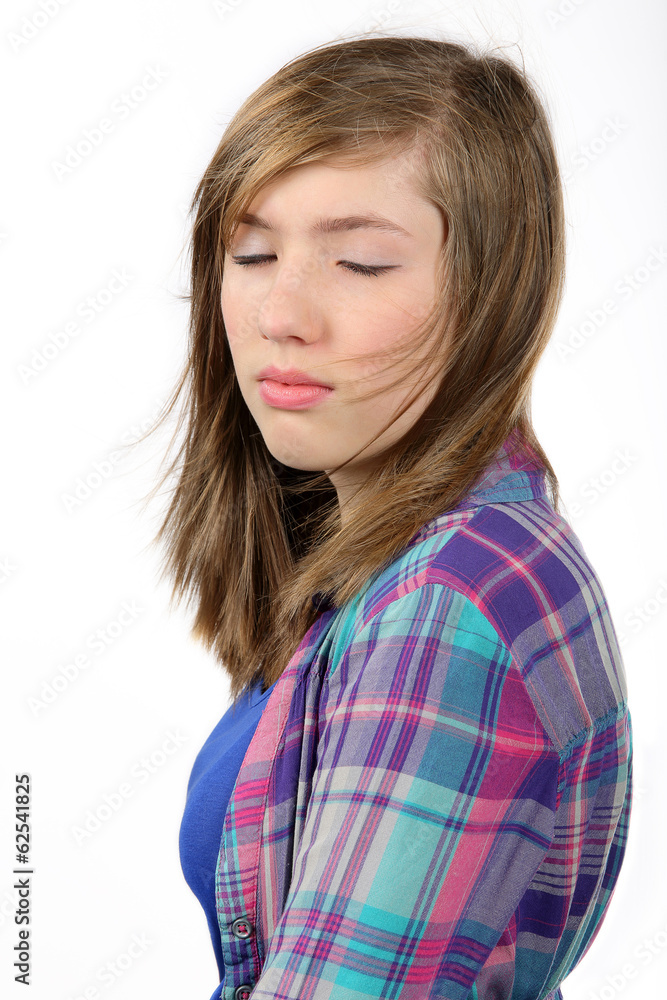 Beautiful teenage girl with eyes closed and flying hair Beautiful teenage girl with eyes closed and flying hair