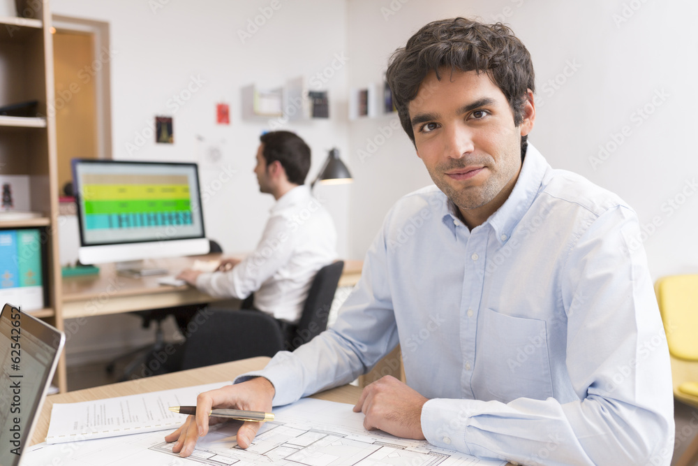 Business team working on laptop in office Business team working on laptop in office