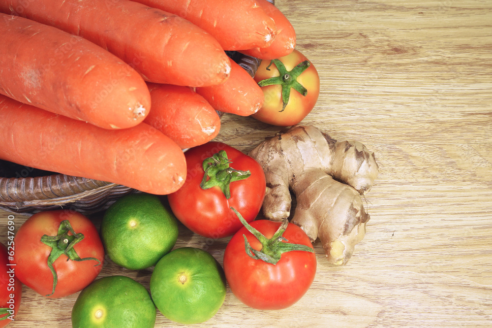 Tomato lemon ginger and carrot in basket Tomato lemon ginger and carrot in basket