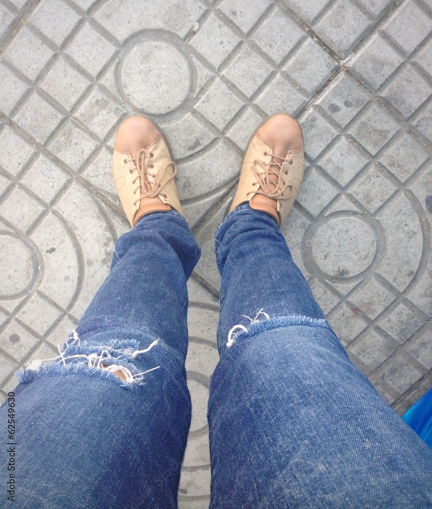 Torn jeans with sneakers. Torn jeans with sneakers.