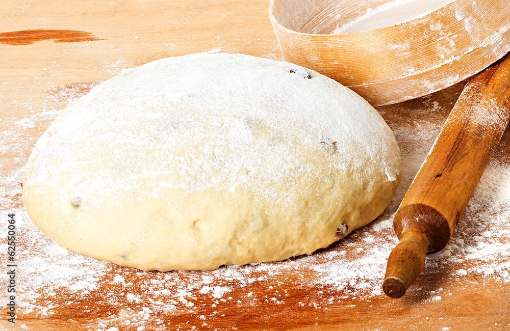 dough with rolling pin on floured table top view dough with rolling pin on floured table top view