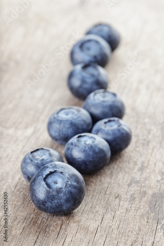 ripe blueberries on wooden table