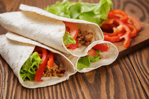 burrito with meat and ingredients