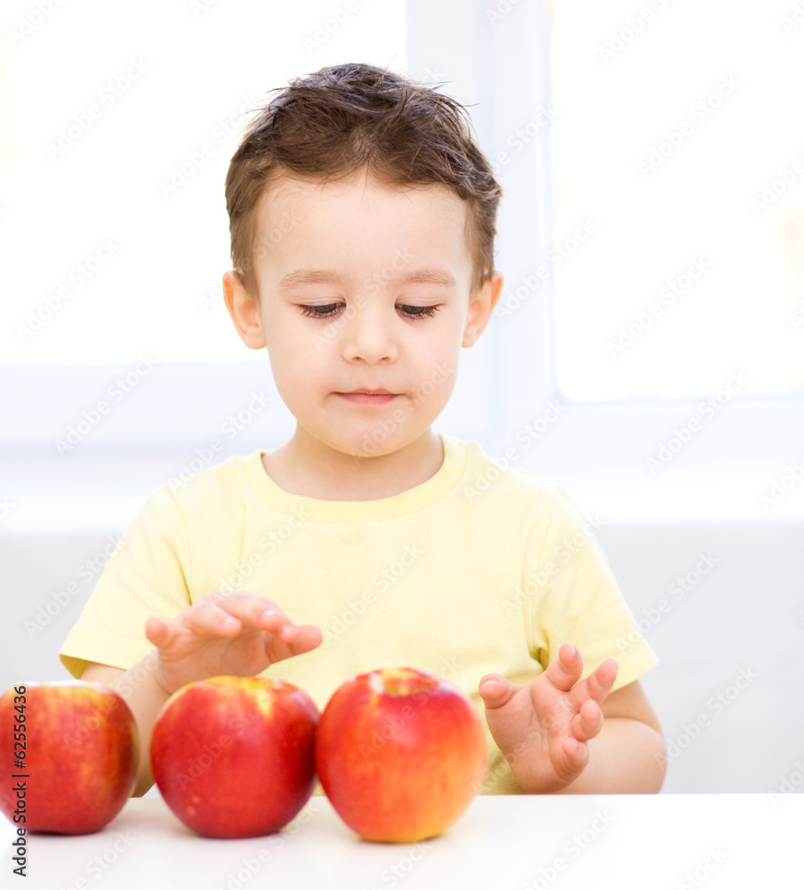 Portrait of a happy little boy with apples Portrait of a happy little boy with apples