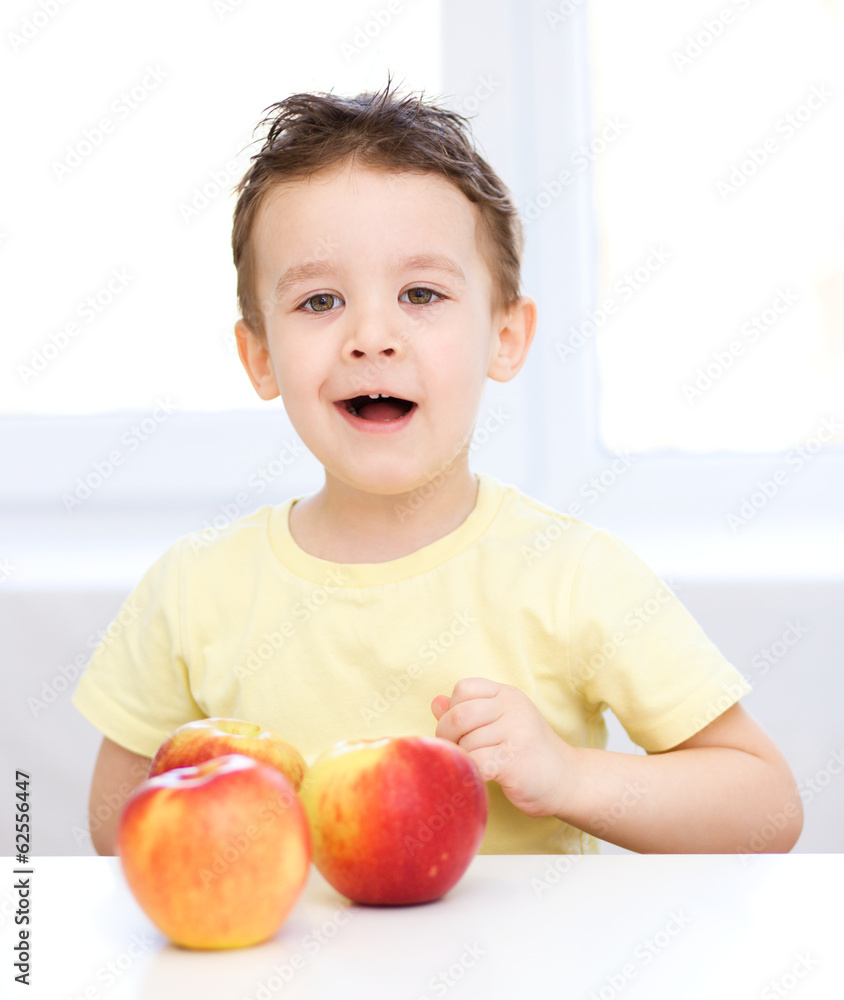 Portrait of a happy little boy with apples Portrait of a happy little boy with apples