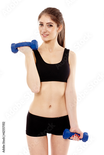 Woman working with dumbbells