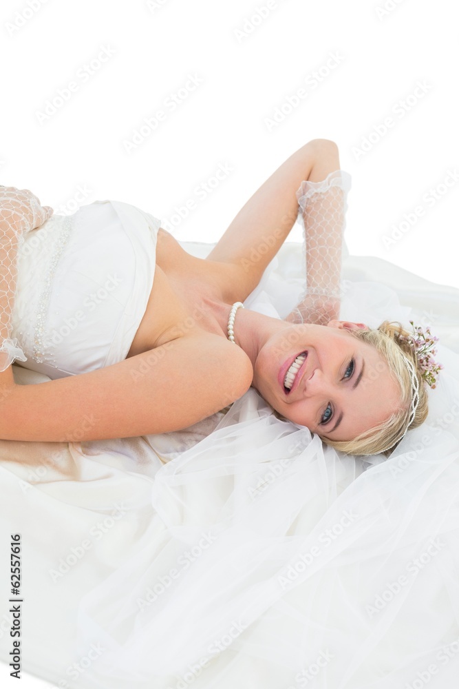 Naklejka premium Happy bride lying against white background