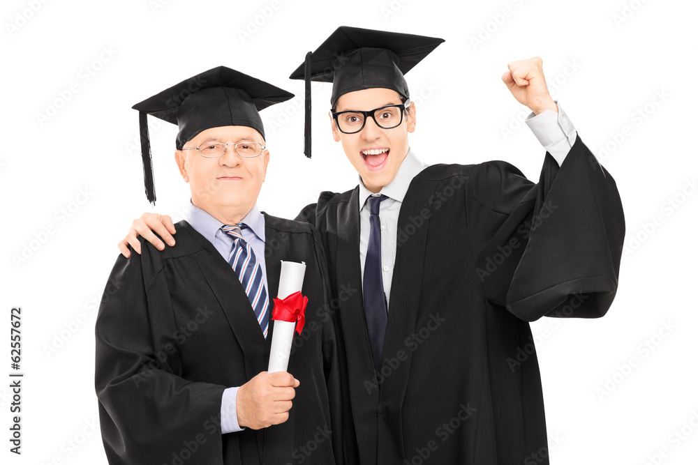Mature and younger college student celebrating graduation Mature and younger college student celebrating graduation