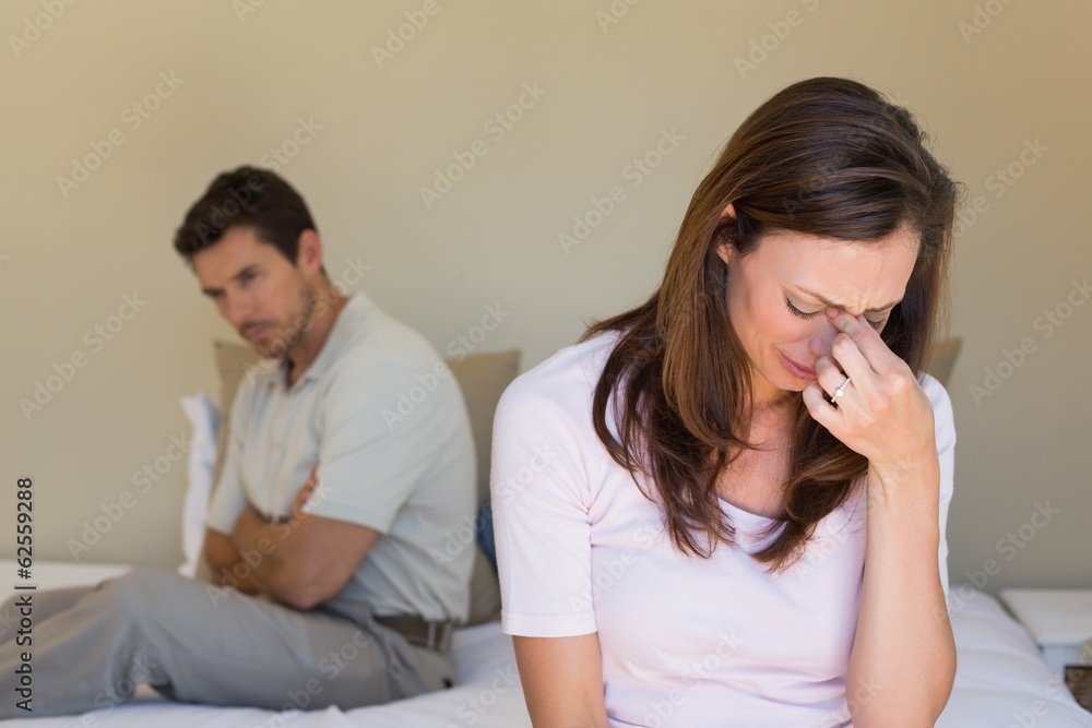 Couple not talking after an argument in bed Couple not talking after an argument in bed