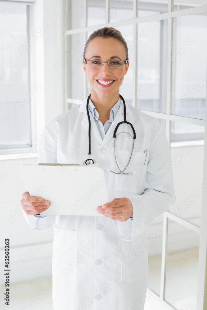 Beautiful female doctor with clipboard in hospital Beautiful female doctor with clipboard in hospital