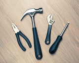  tools against wooden background
