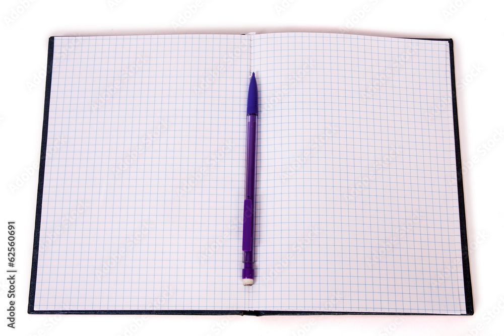 pencil on checked notebook isolated on white background pencil on checked notebook isolated on white background