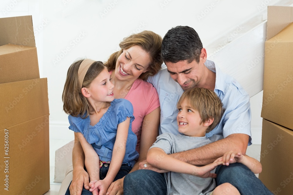 Happy family sitting in new house Happy family sitting in new house