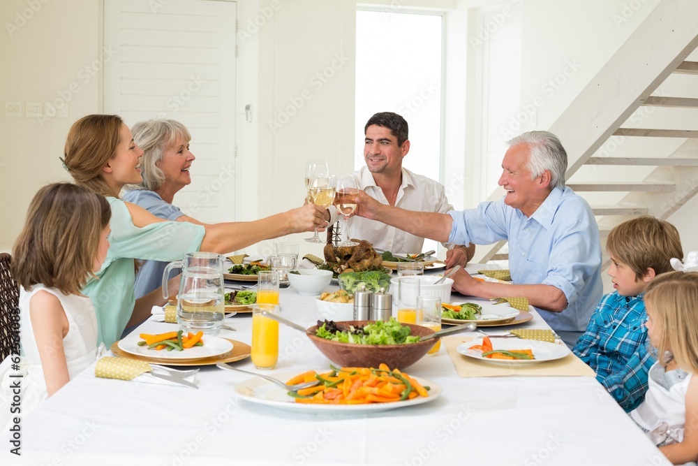 Family toasting while having meal