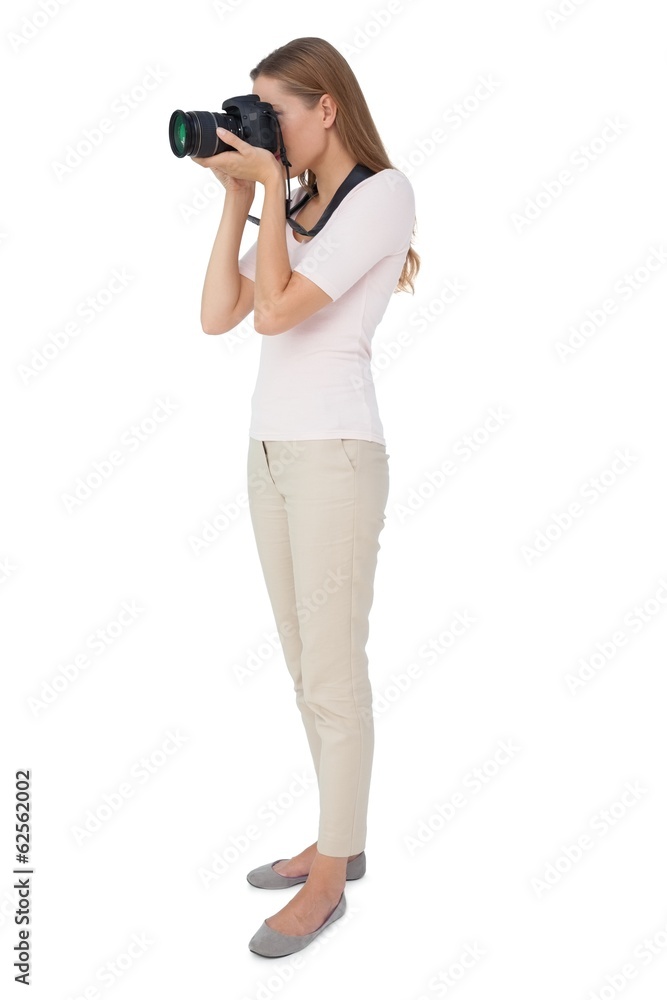 Full length side view of a woman with camera Full length side view of a woman with camera