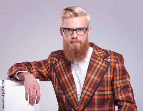 fashion man with long red beard and glasses resting