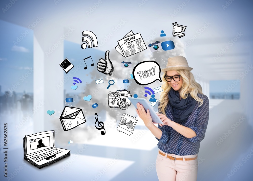 Obraz premium Stylish blonde using tablet pc with app icon doodles