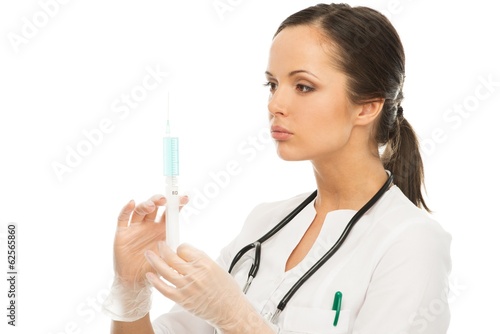 Young brunette doctor woman with syringe isolated on white
