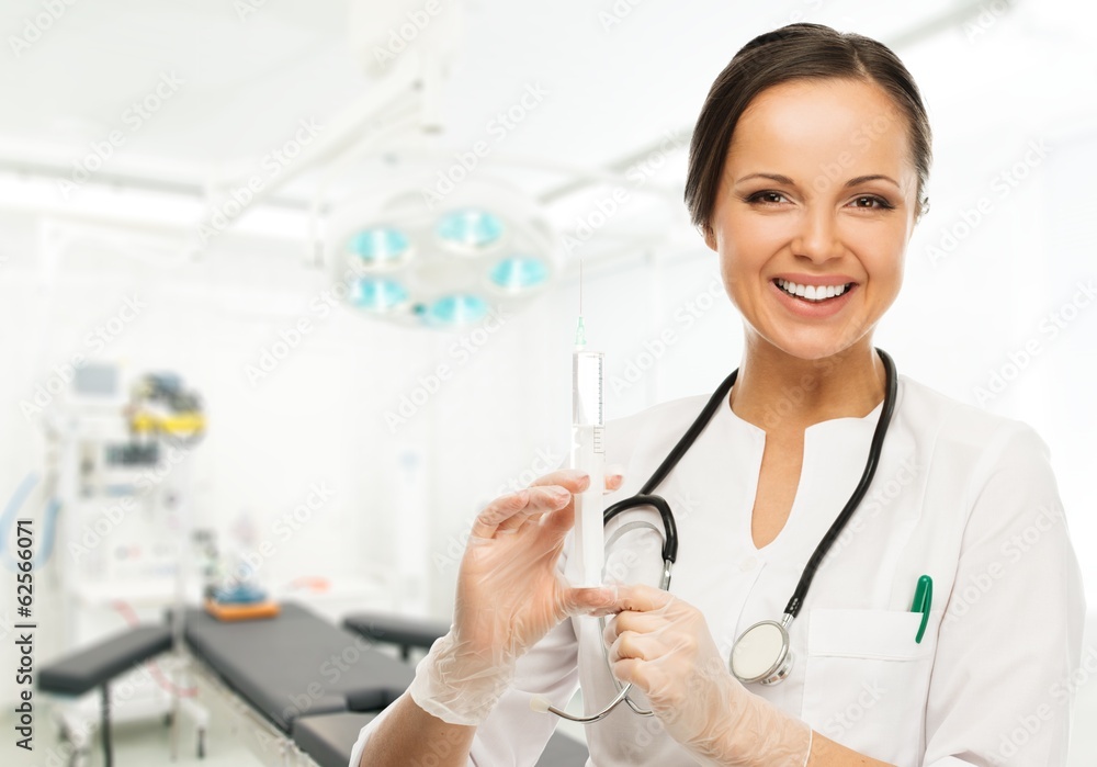 Young positive brunette doctor woman with syringe Young positive brunette doctor woman with syringe