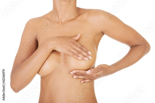 Adult woman examining her breast © Piotr Marcinski