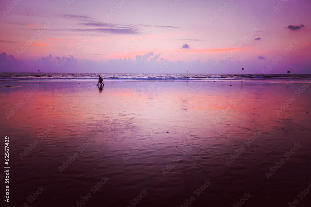 Sunset on Baga beach. Goa - obrazy, fototapety, plakaty 