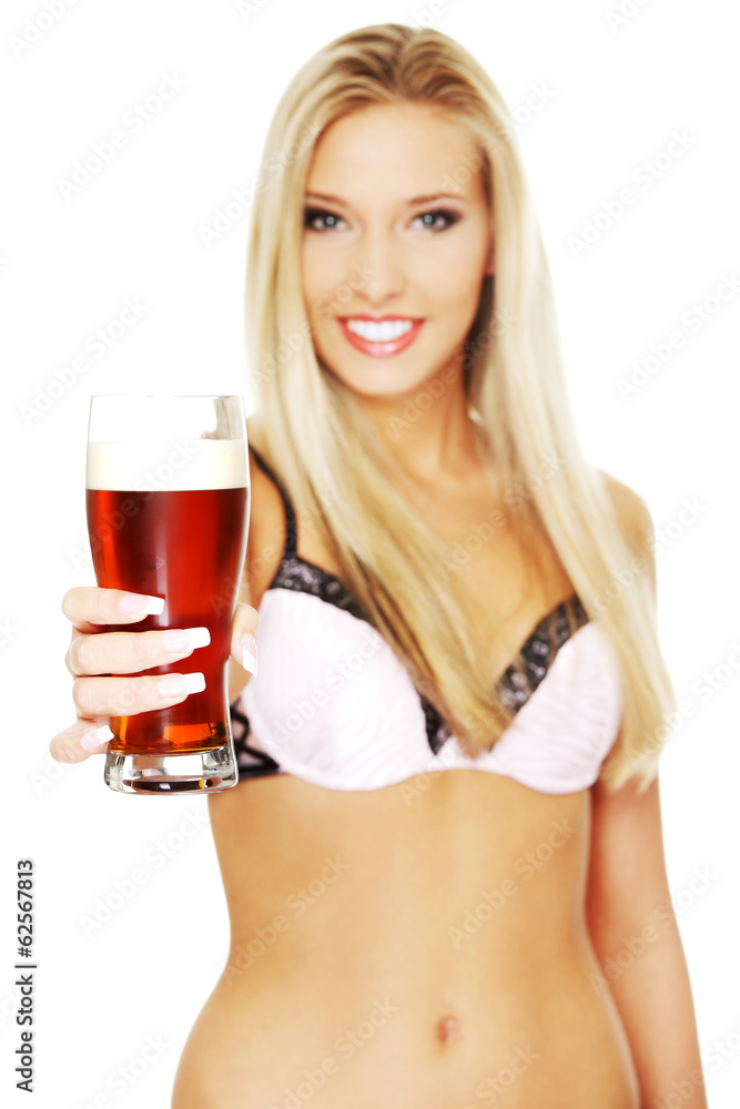 Beautiful and sexy woman holding glass of beer Beautiful and sexy woman holding glass of beer