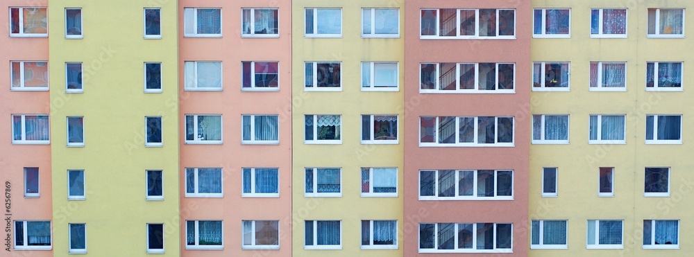 Windows of the rooms in the big apartment building.