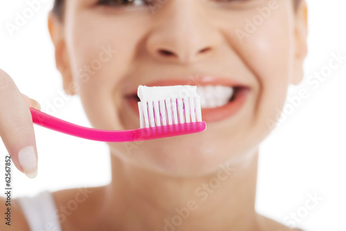 Woman holding tooth brush