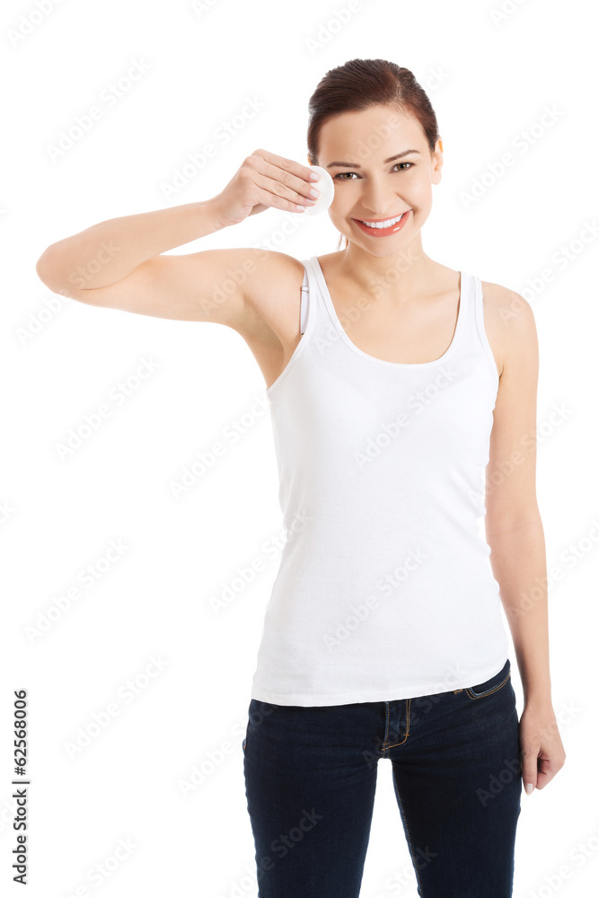 Woman using cotton pad Woman using cotton pad