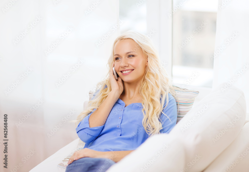 smiling woman with smartphone at home smiling woman with smartphone at home