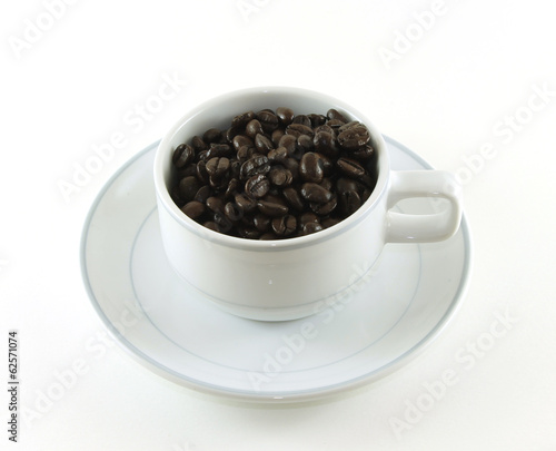 Coffee beans in a coffee mug