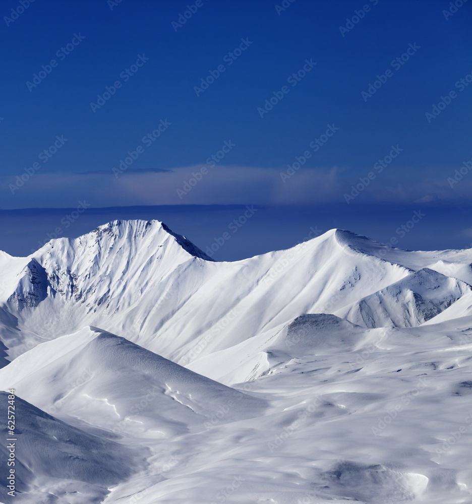 View on off-piste snowy slope at nice sunny day View on off-piste snowy slope at nice sunny day