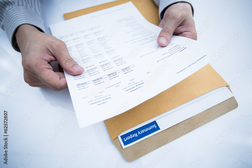 man hand with pen and business report man hand with pen and business report