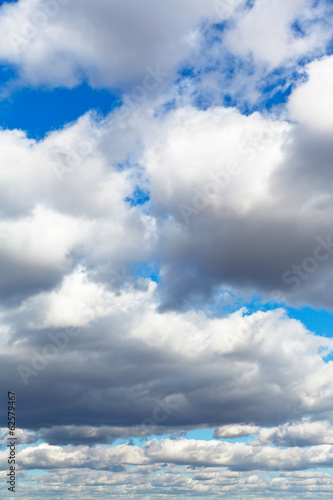 heavy woolpack clouds in spring sky