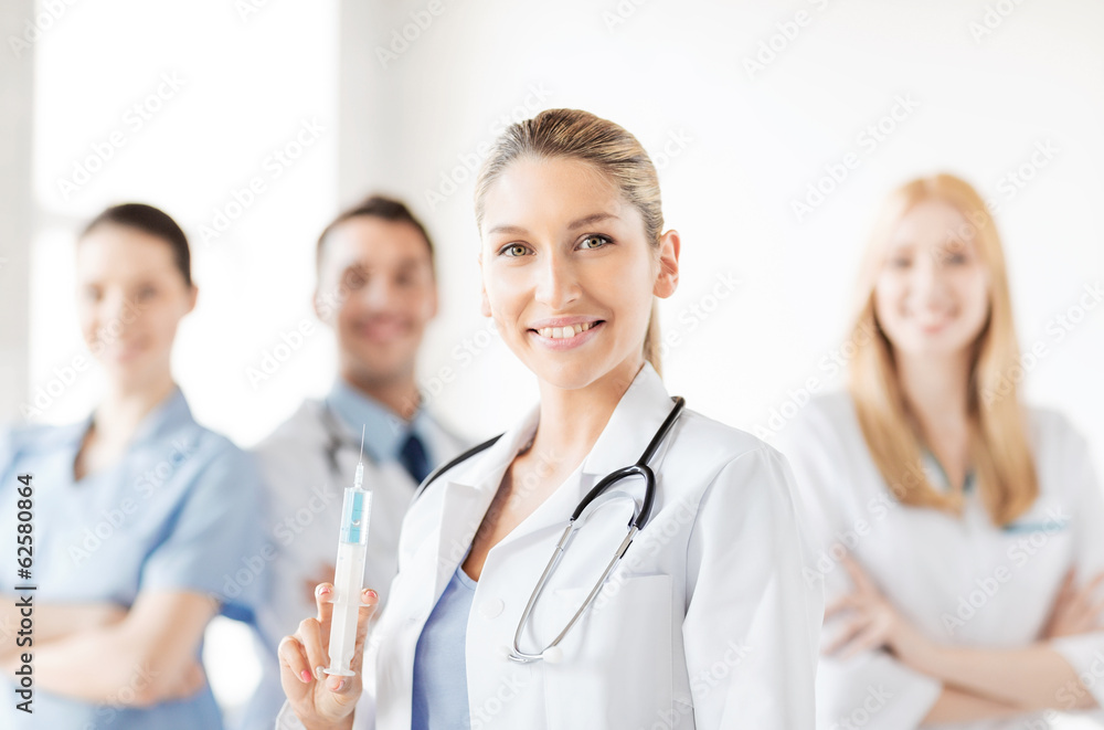 female doctor holding syringe with injection female doctor holding syringe with injection
