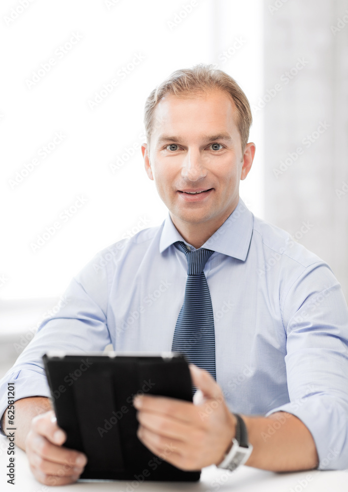 businessman with tablet pc in office businessman with tablet pc in office