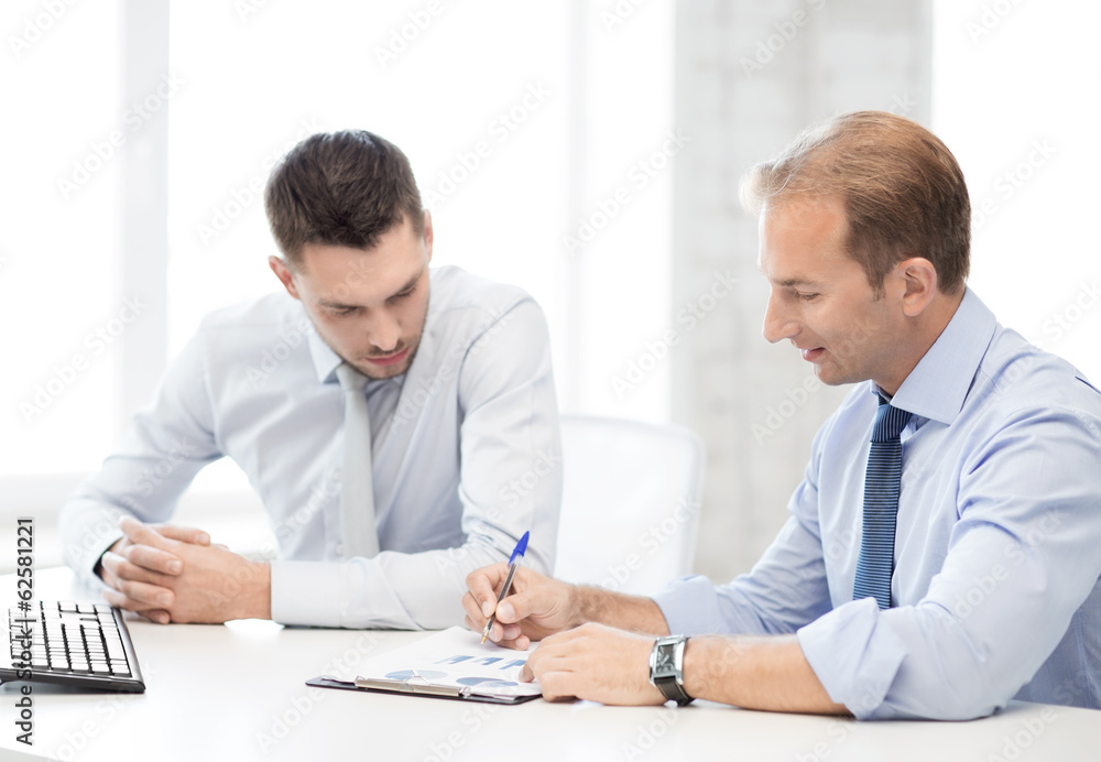 businessmen with notebook on meeting businessmen with notebook on meeting