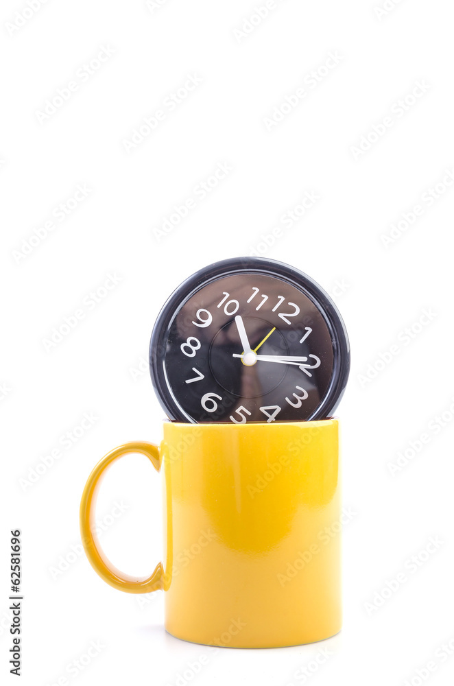 Yellow mug and clock Yellow mug and clock