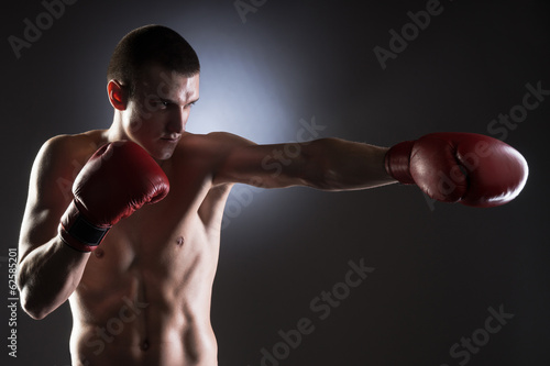 Fighter's kick. Studio shot.