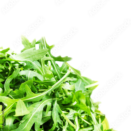 Arugula salad isolated on white background close up. Heap of fr