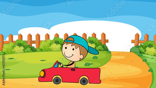 A young boy in his car