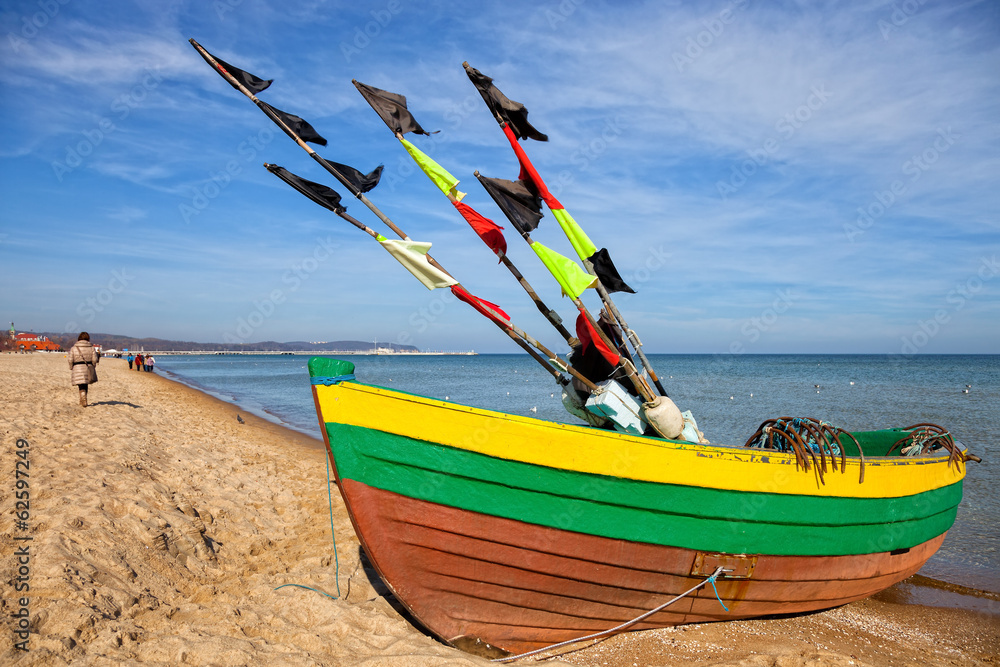Fototapeta premium Old fishing boat at the beach in Sopot Poland.