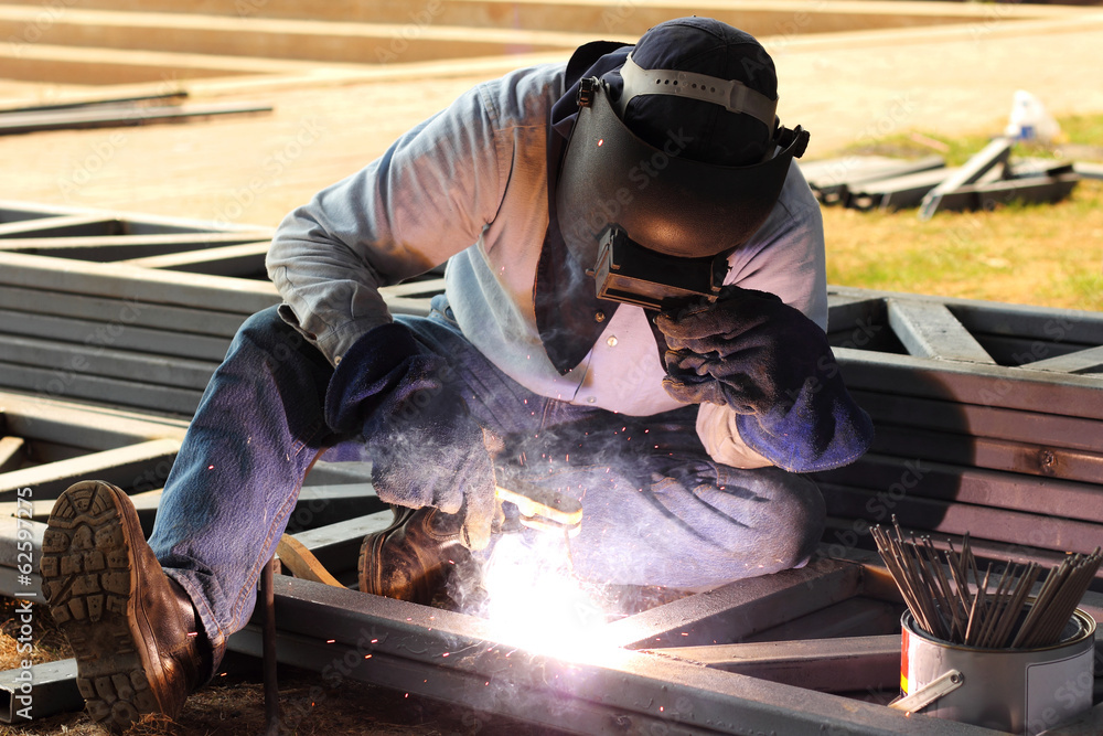 welder welding steel metal on construction site welder welding steel metal on construction site
