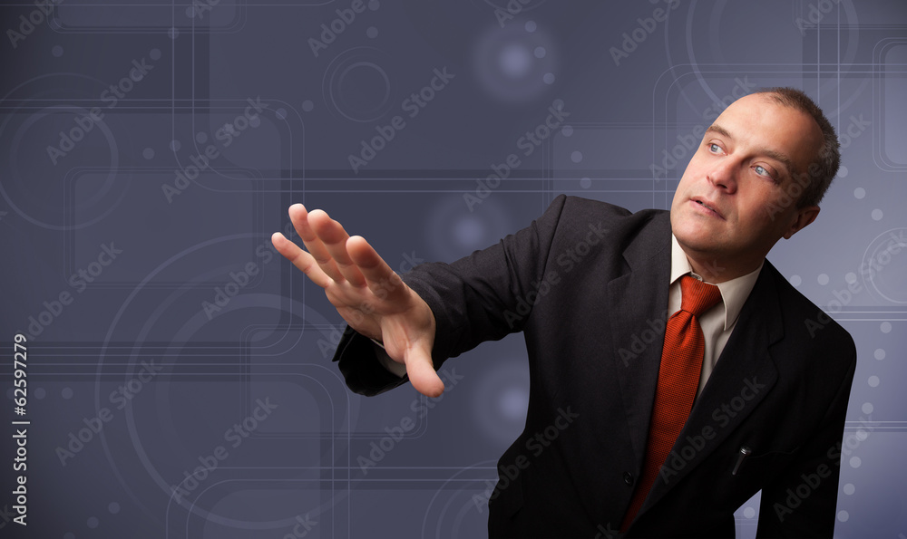 Elegant businessman touching copy space Elegant businessman touching copy space