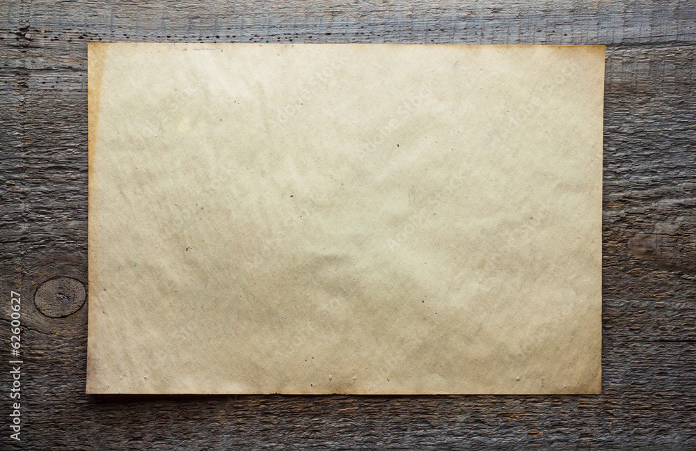 paper on wooden background paper on wooden background