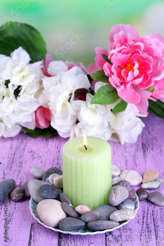 Composition with spa stones  candle  and flowers