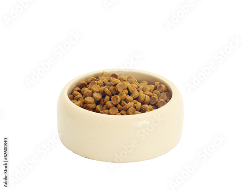 dry cat food in beige bowl isolated on white