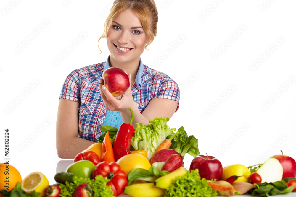 woman eating apple with lot of fruits and vegetables woman eating apple with lot of fruits and vegetables