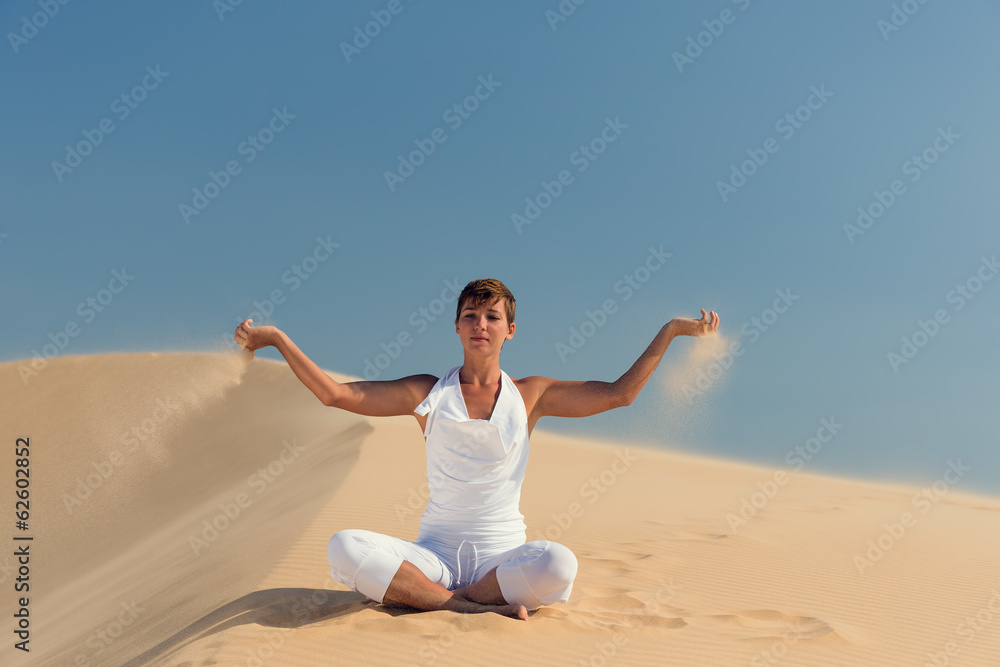 Yoga meditation on the beach, healthy female body in peace Yoga meditation on the beach, healthy female body in peace
